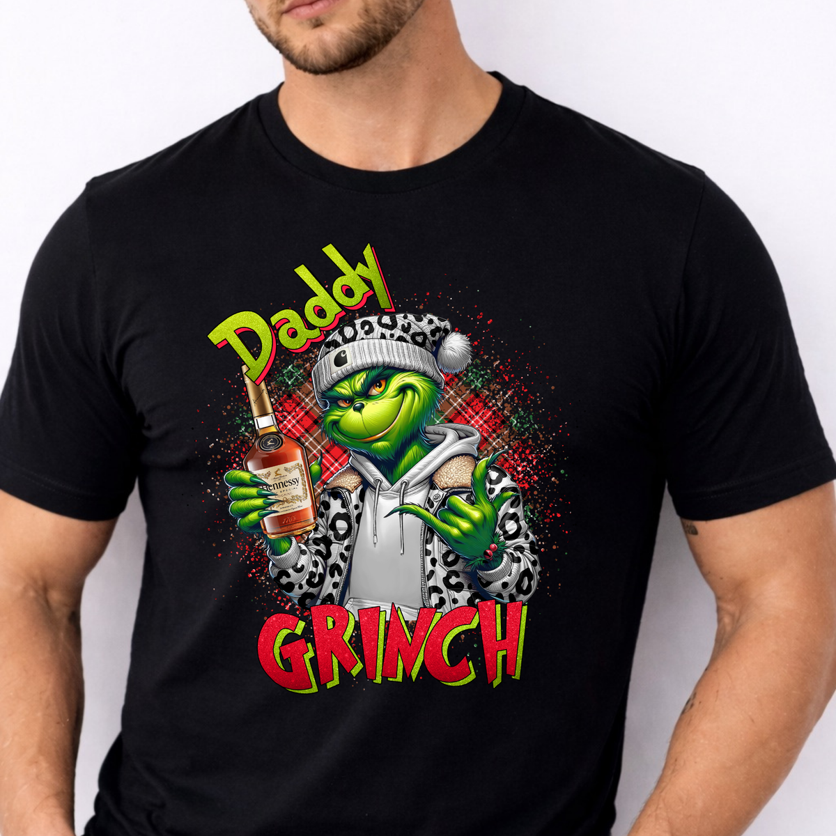 Funny Daddy Grinch Christmas T-shirt featuring a cool green festive character. A cheeky Christmas gift for Dad, perfect for parties and festive outfits.