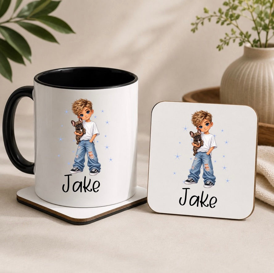 A white ceramic mug with a black handle and interior, printed with an illustrated boy holding a dog and the name 'Jake', shown alongside a matching square coaster on a beige tabletop with soft plant and vase props in the background.